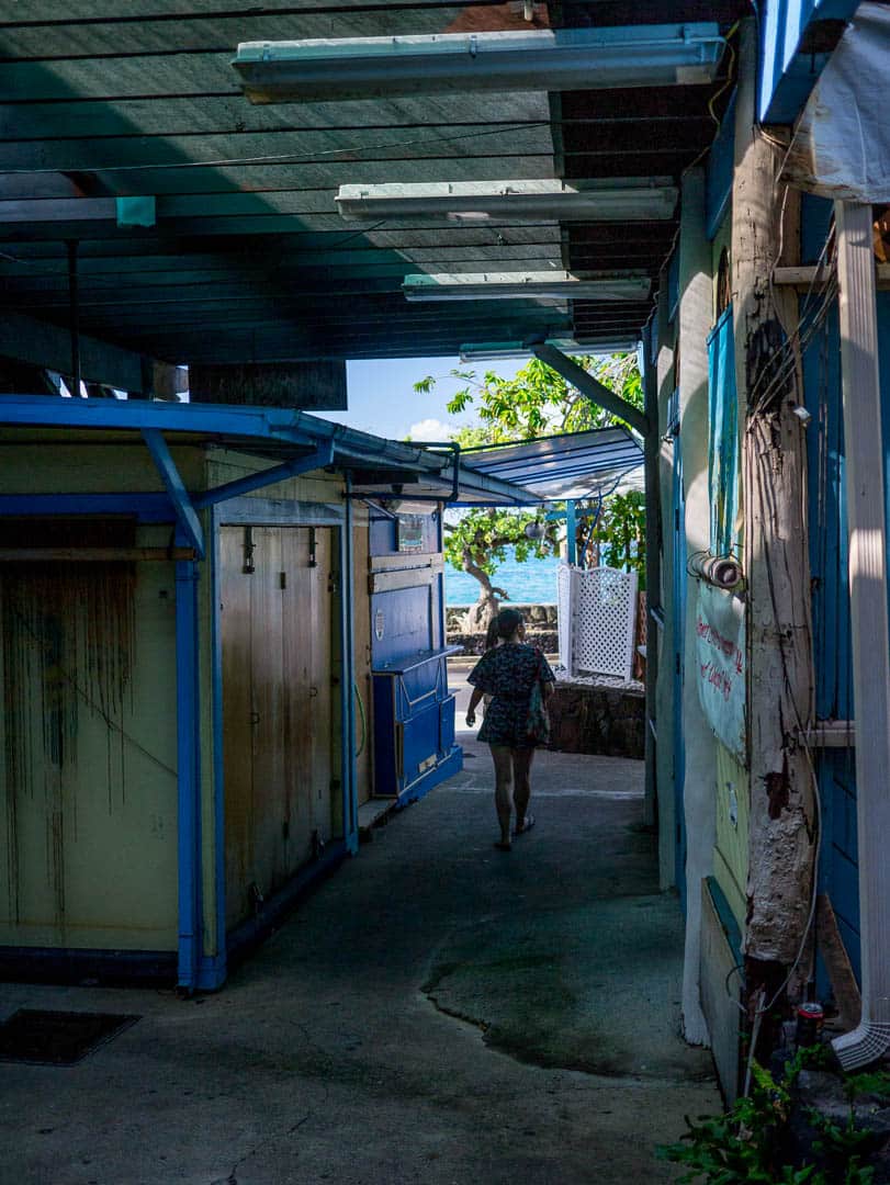 A walkway between buildings by the beach