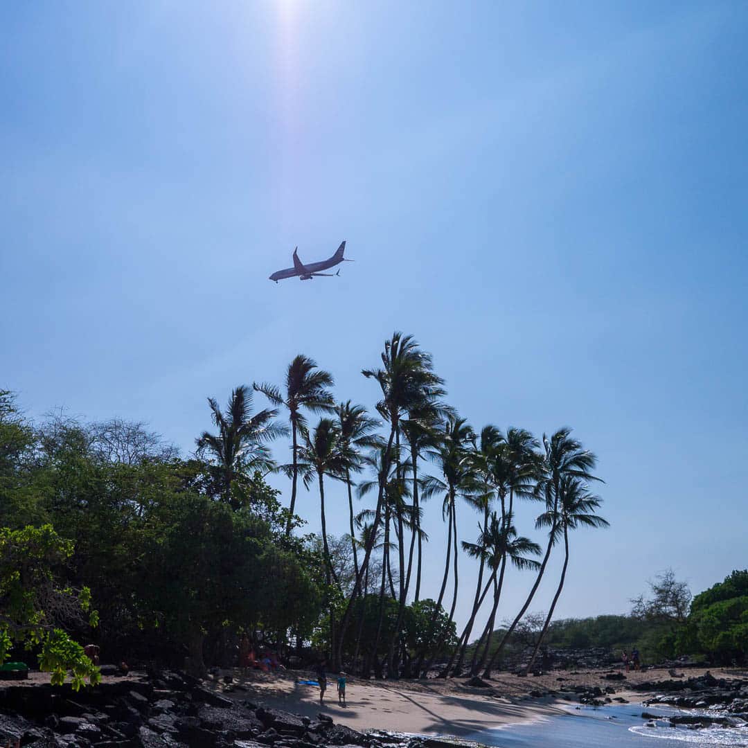 Aeroplane landing over the beach