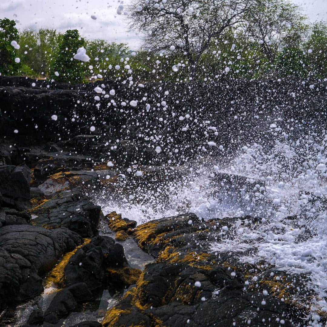 Ocean spray and black cliffs