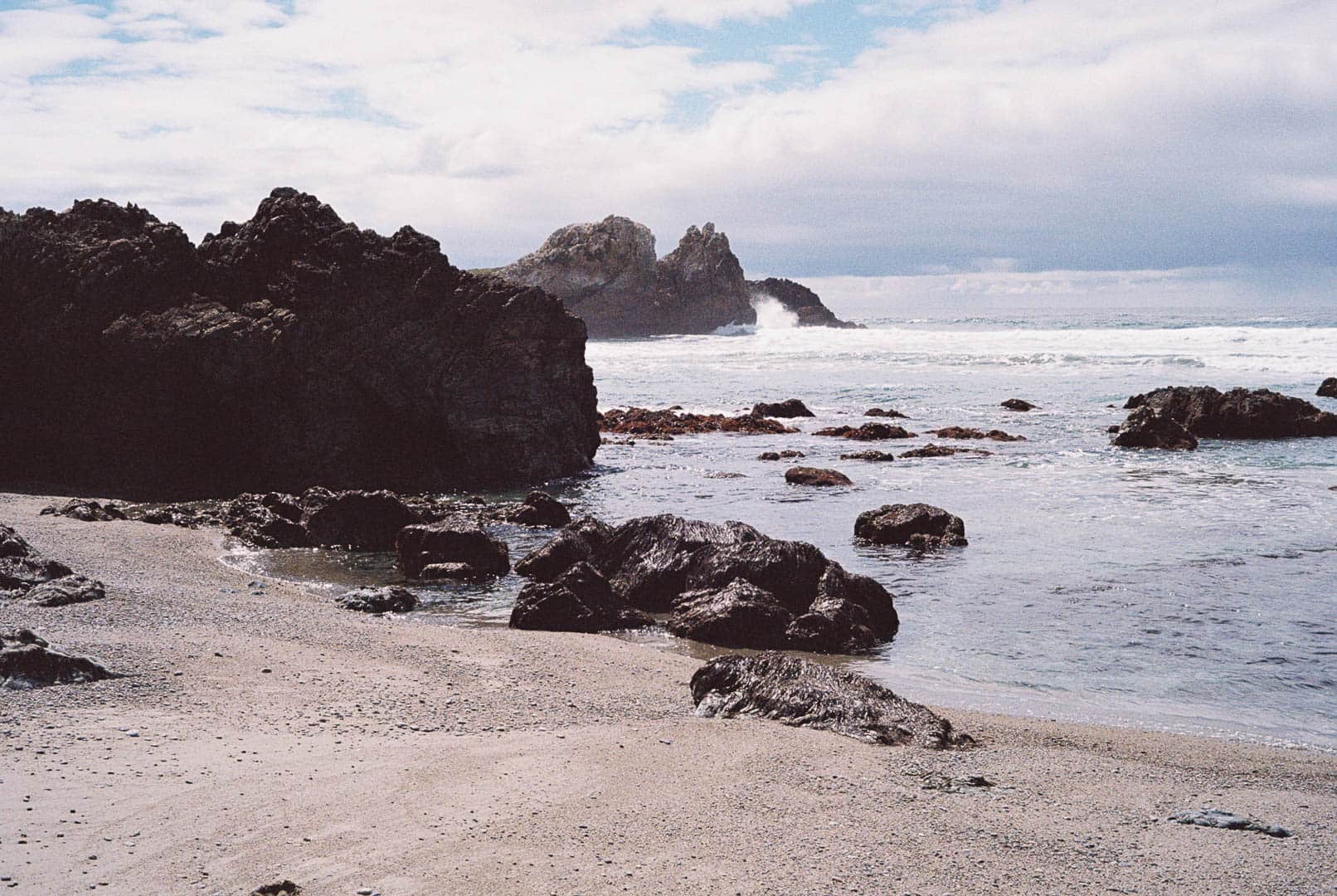 Rocky shoreline and a sandy beach