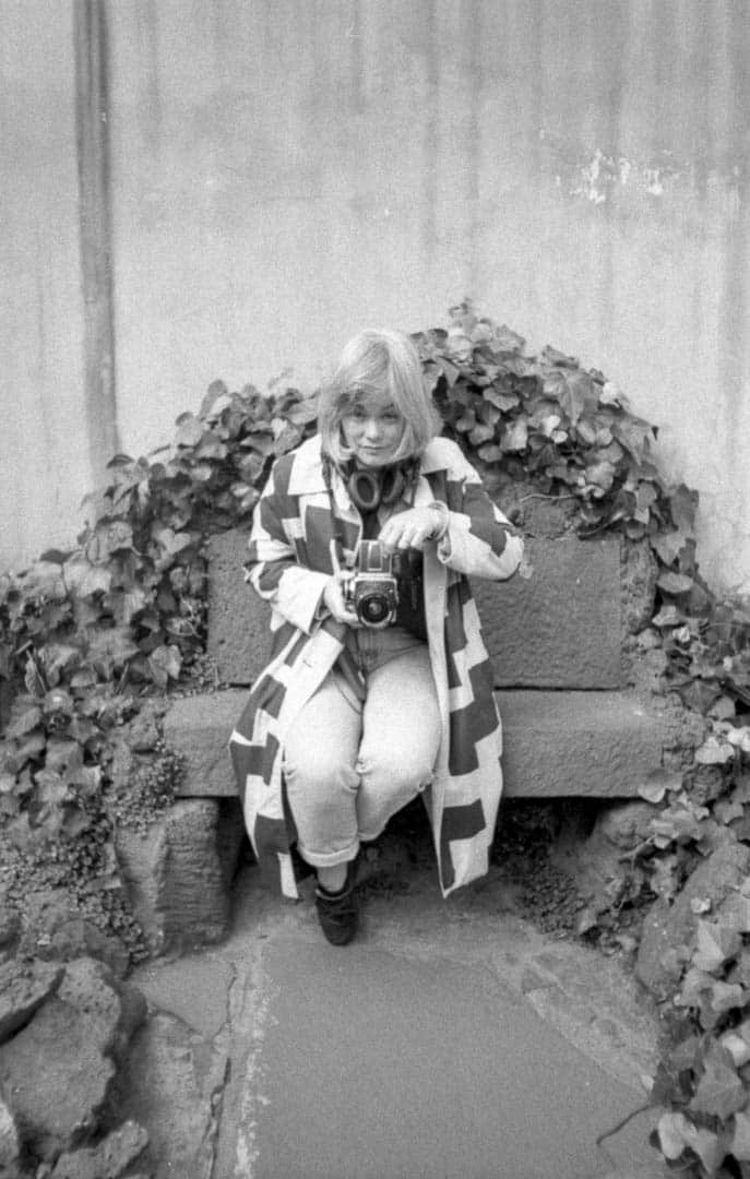 A woman taking a photograph at Frida Kahlo’s home