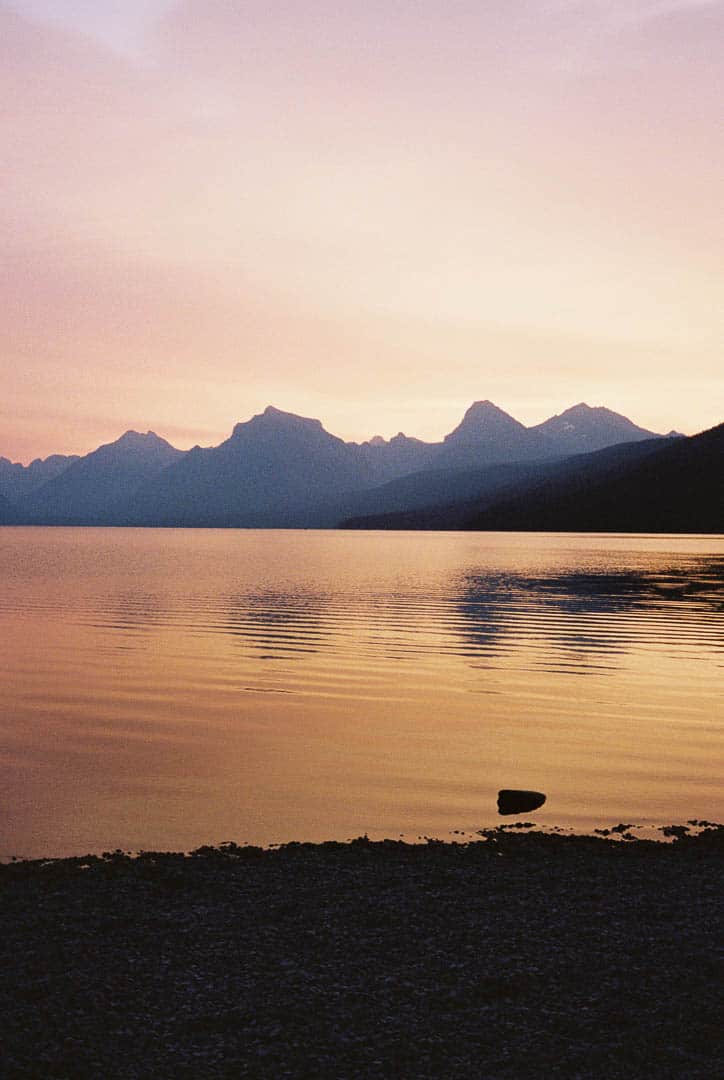 Sun setting and dusk falling over a lake