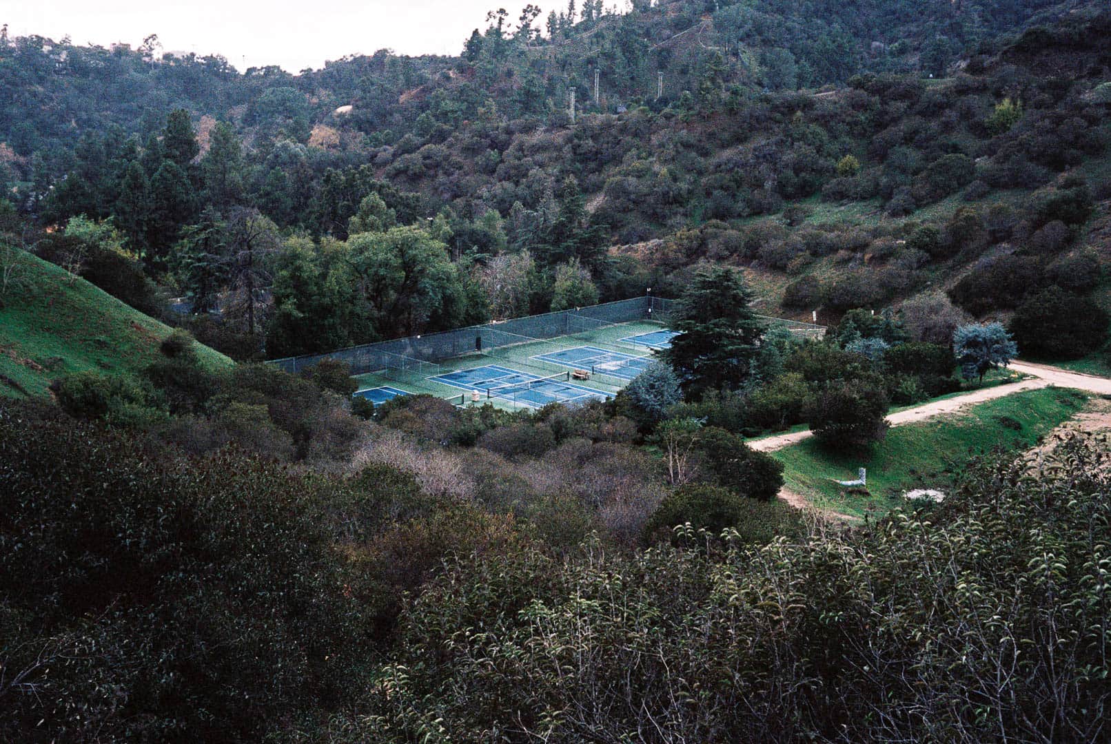 Tennis court at a distance in the reain