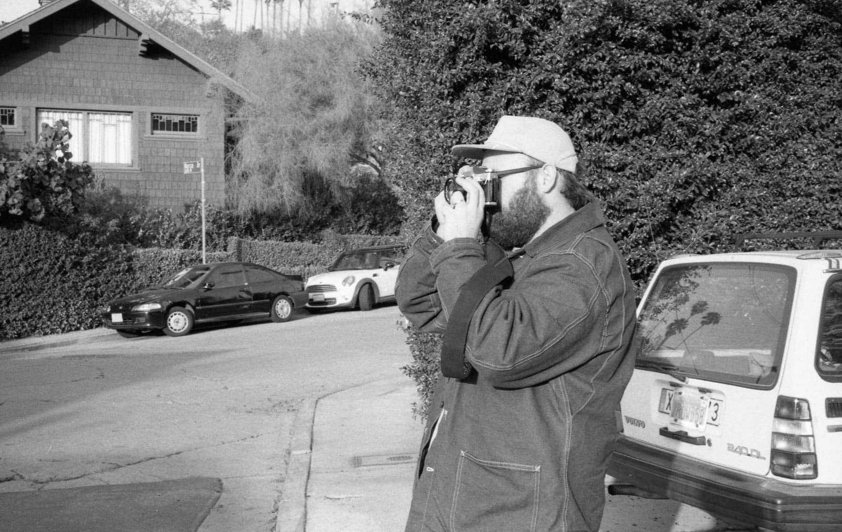 Ben taking a photo of a house