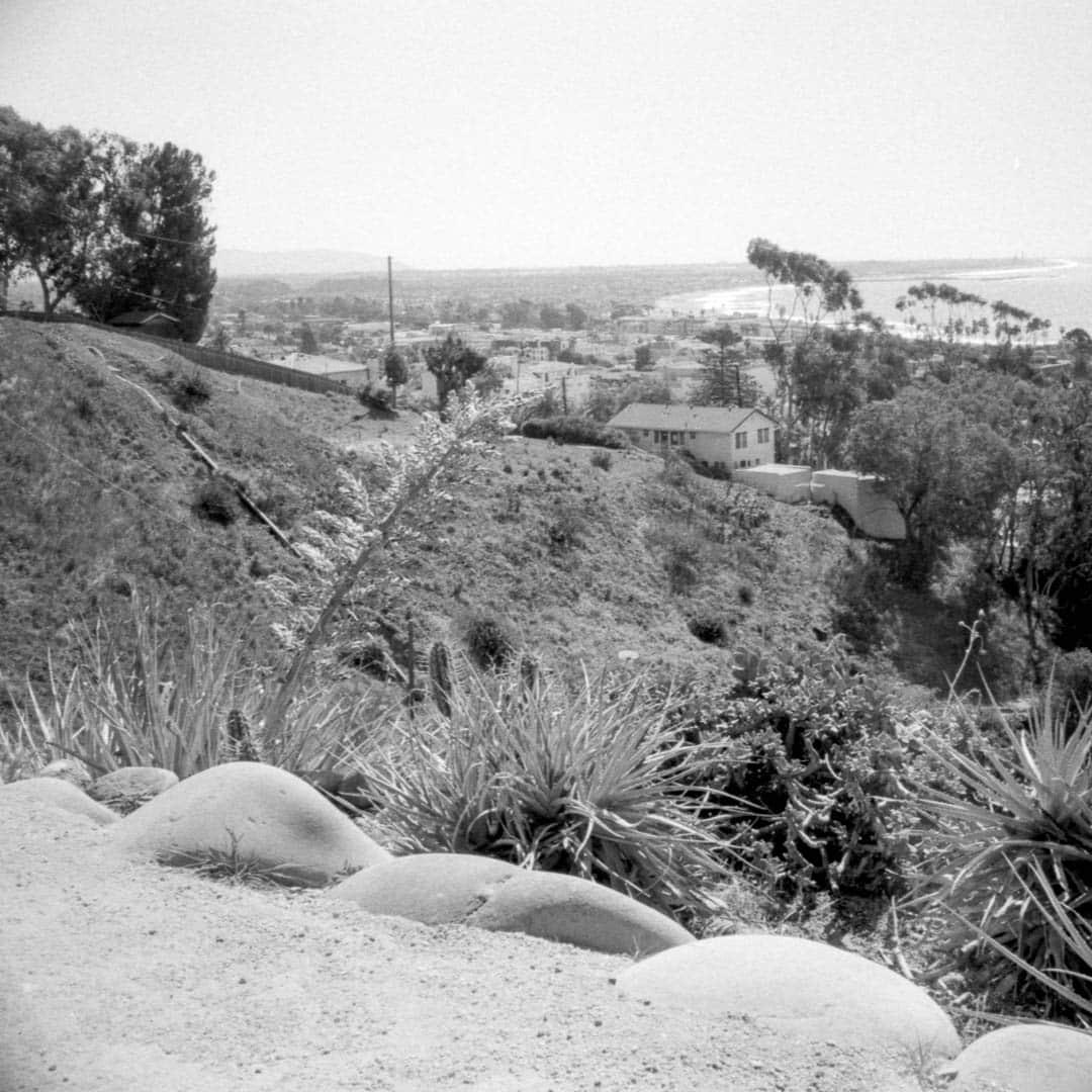 An overlook from an elevated path over the ocean