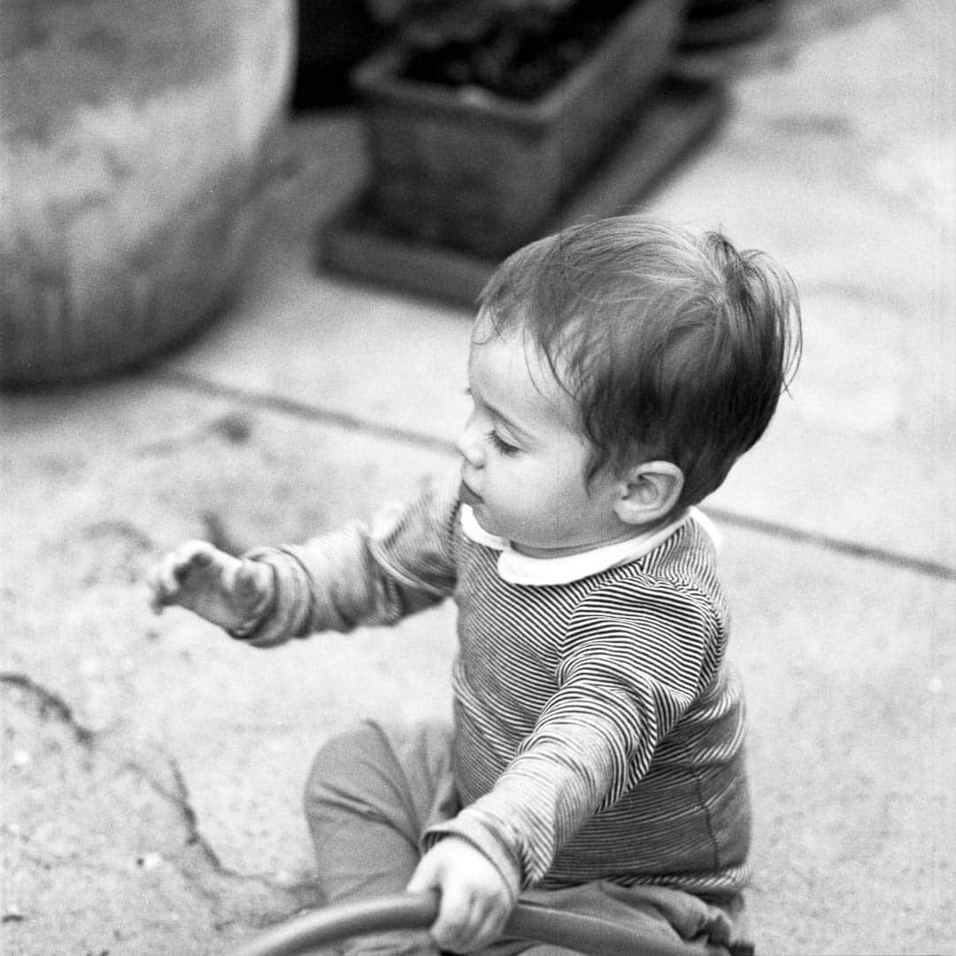 A baby outside in the garden